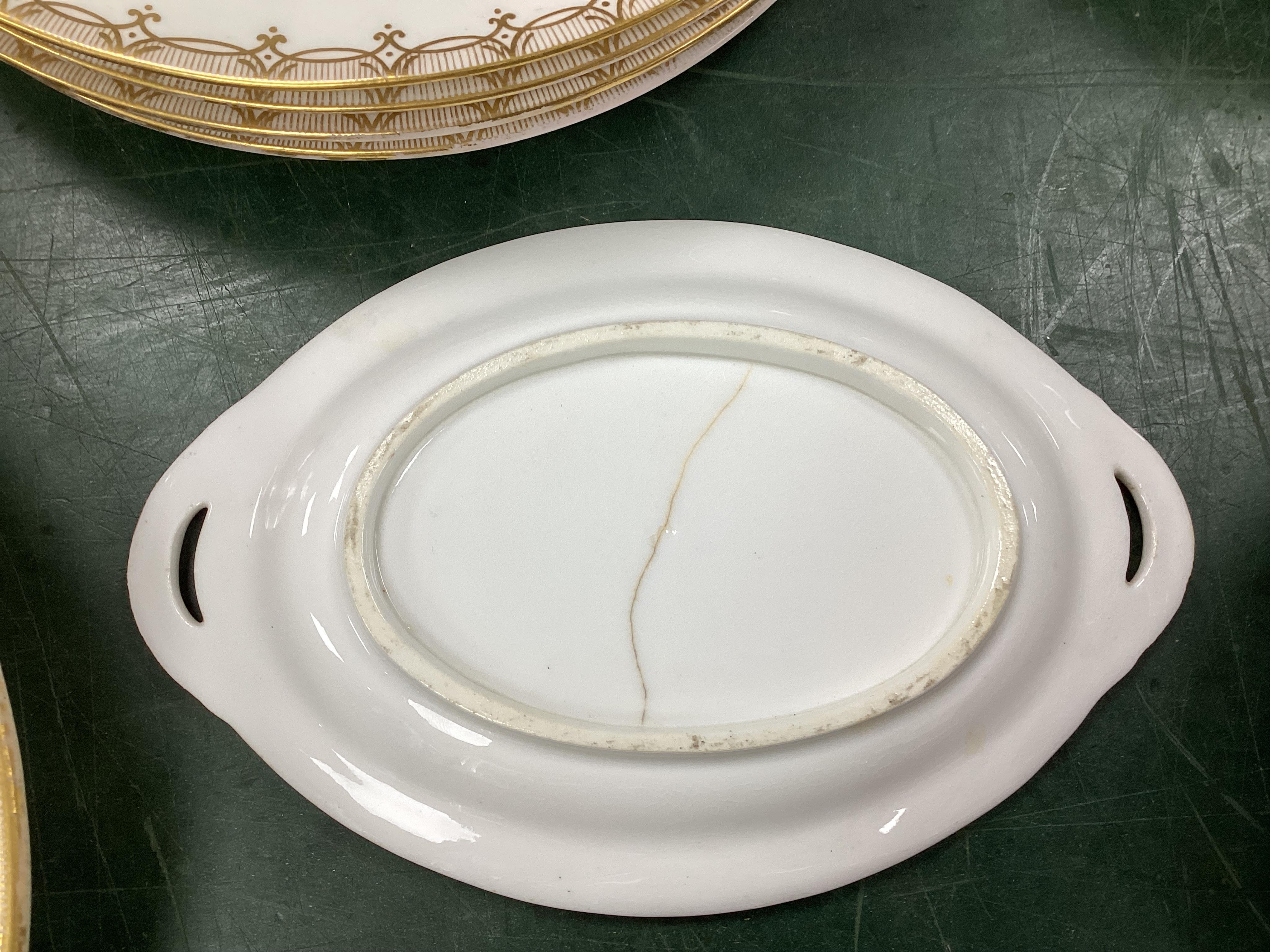 A Coalport bird painted part dinner service, mid 19th century